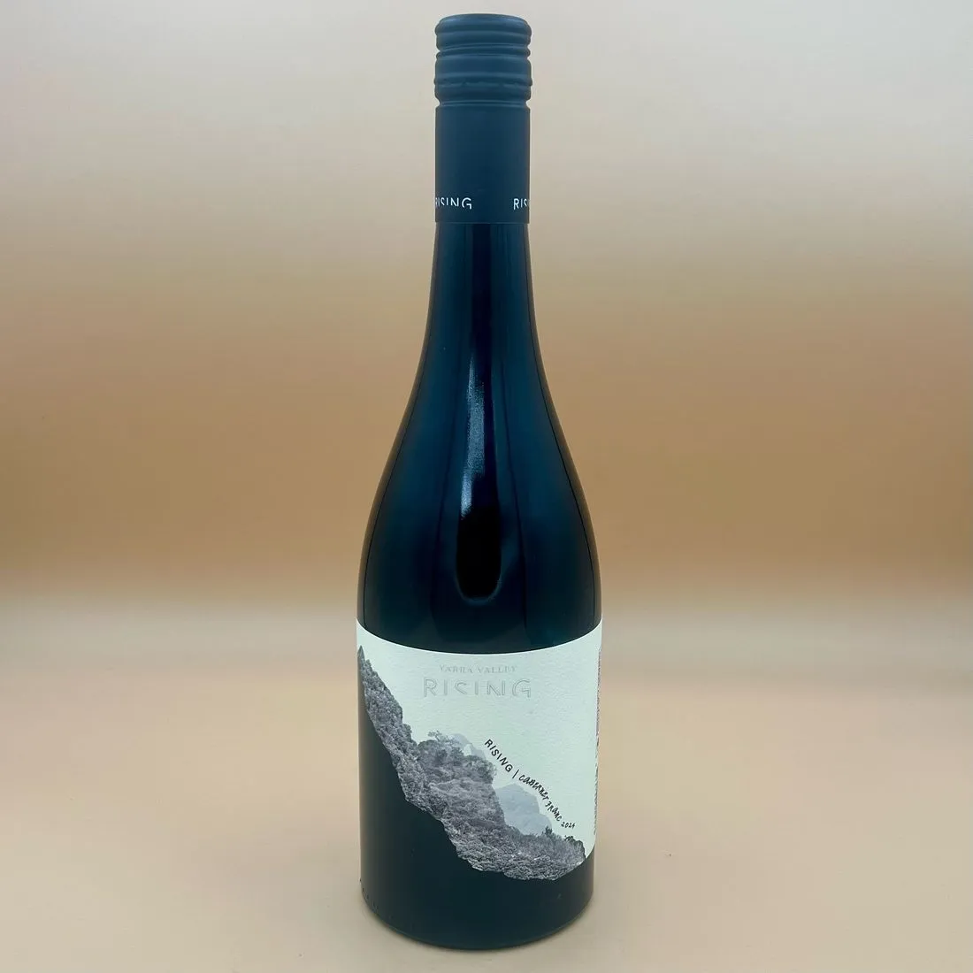 A bottle of Rising Yarra Valley Cabernet Franc on a warm neutral background